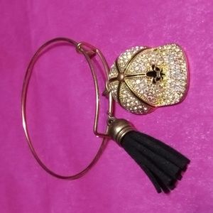 Charm bangle bracelet with tassel and saints ball cap.(sku 115)